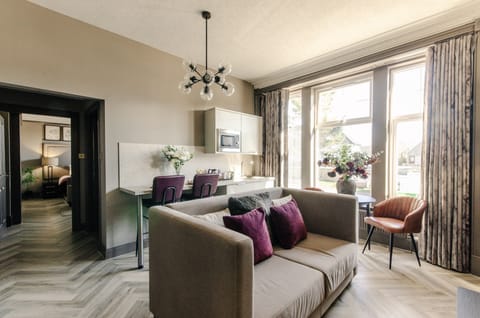 Deluxe Studio Suite, Non Smoking, Ground Floor | Living area | 50-inch Smart TV with digital channels