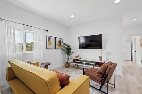 Comfortable living room with ample seating and smart TV.