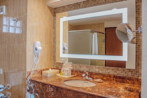 Deluxe Room, Balcony, Ocean View | Bathroom | Shower, towels, soap, shampoo