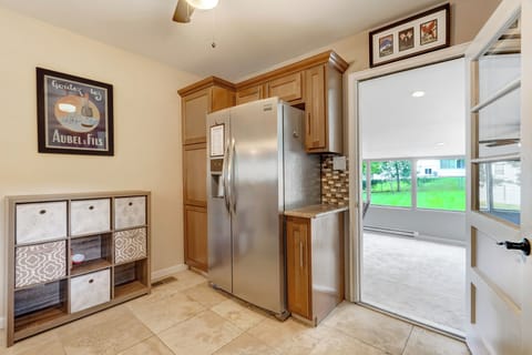 Fully equipped kitchen with plenty of light. This door leads to the sun room