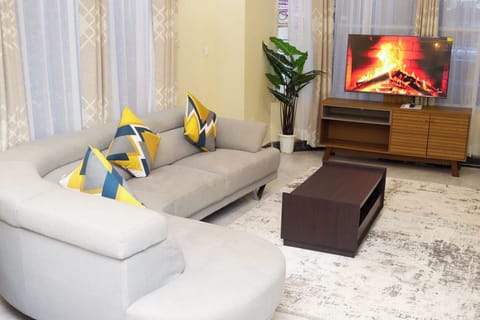 Superior Apartment, 3 Bedrooms, Kitchen, Garden View | Living area | Flat-screen TV