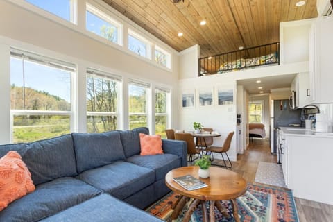 Living Room Comfort: Spacious living room with ample seating and natural light.