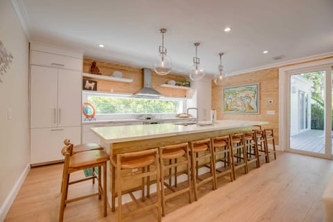 Gourmet kitchen with Keurig coffee machine, lots of cookware, and enough dishes and utensils for everyone