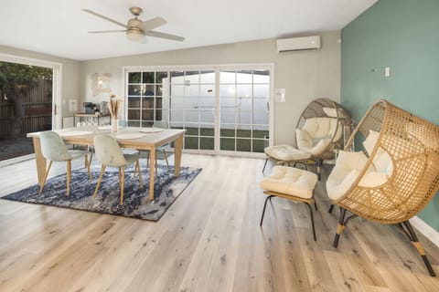 Dining Room: Bright space for memorable meals, featuring modern decor and backyard views!