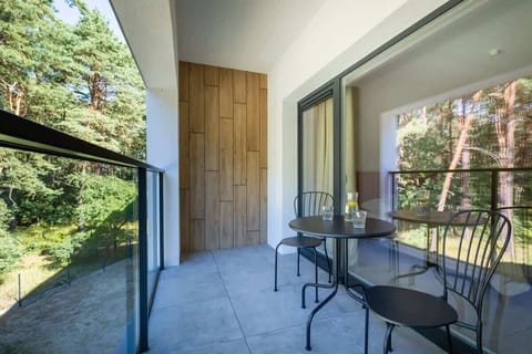 Private balcony with outdoor seating – Perfect for morning coffee or evening drinks.

