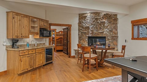 Lower level family room with fireplace and set bar