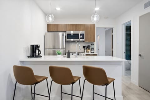 As you take your seat, the dining room's sophisticated design sets the stage for memorable meals and conversations.