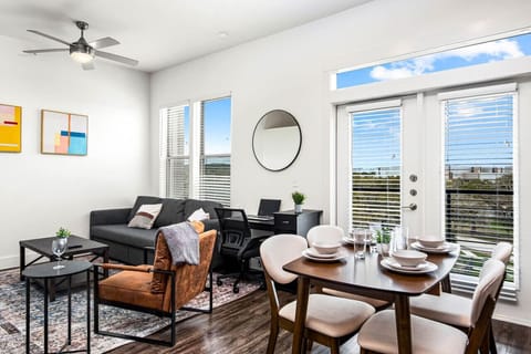 The living room is filled with natural light, creating a bright and welcoming space that invites relaxation.