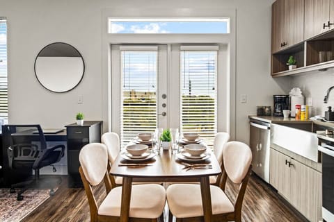 The dining room is bathed in natural light, creating a bright and inviting space where every meal feels special.