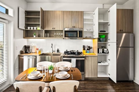 You’ll love the convenience of this fully equipped kitchen, where you can brew coffee, cook meals, or prepare snacks. The cozy layout and warm ambiance make cooking here a delightful part of your stay.