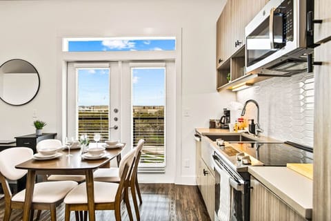 Set the table for memorable meals in this beautifully arranged dining area. With elegant place settings and a charming centerpiece, it's perfect for hosting dinner parties or enjoying family dinners in a cozy and stylish atmosphere.
