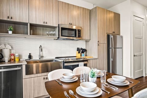 Set the table for memorable meals in this beautifully arranged dining area. With elegant place settings and a charming centerpiece, it's perfect for hosting dinner parties or enjoying family dinners in a cozy and stylish atmosphere.