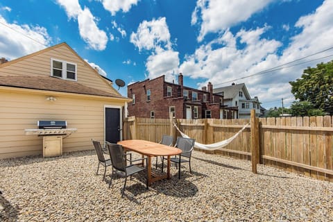 Our backyard is fenced in and contains both a grill and hammock.