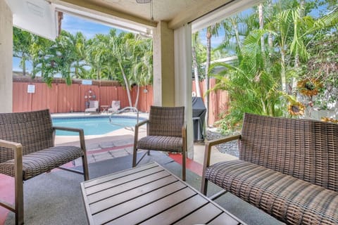 Exclusive patio equipped with cozy furniture, offering an inviting setting for outdoor gatherings and leisurely moments.