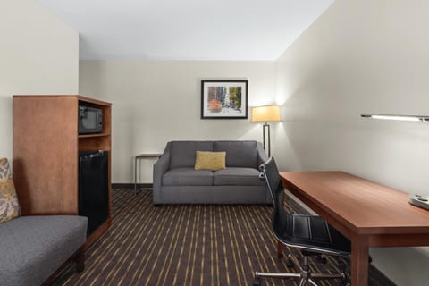 Suite, 1 King Bed | Living room | 55-inch LED TV with satellite channels, TV