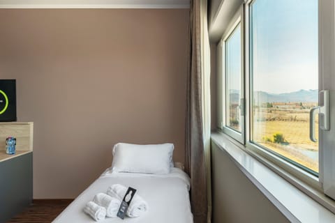 Hypo-allergenic bedding, down comforters, desk, laptop workspace