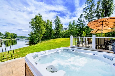 Relaxing hot tub with serene lake views, perfect for unwinding in nature
