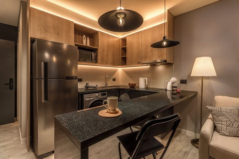 Deluxe Studio, Balcony, City View | Private kitchen | Fridge, microwave, oven, stovetop