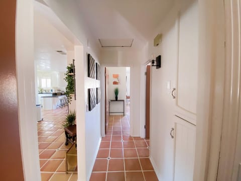Hallway connecting bedrooms and guest bathroom