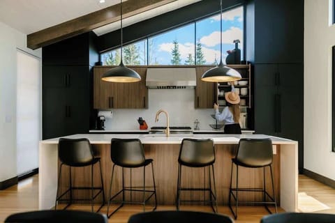 - Prepare a meal in a kitchen that feels like a work of art, with its unique design and ample space. The open layout is perfect for socializing while you cook, with a large island as the heart of the home.