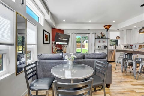Dine in comfort with this cozy table, perfectly situated next to the living area for easy access.