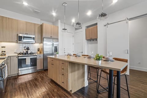 The kitchen invites you to experiment with new recipes, offering a stylish and practical space to cook and create.