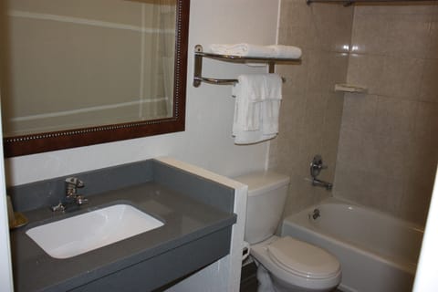 Standard Double Room, 2 Double Beds | Bathroom | Combined shower/tub, hair dryer, towels