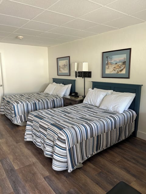 Standard Quadruple Room | Blackout drapes, iron/ironing board, free WiFi, bed sheets