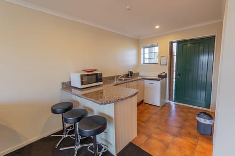 Premium Two Bedroom Suite | Private kitchen | Mini-fridge, microwave, stovetop, cookware/dishes/utensils