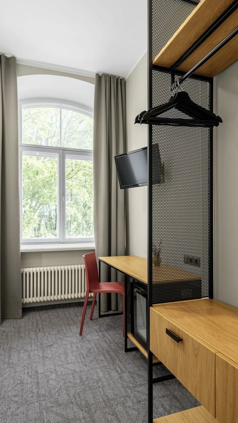 Double or Twin Room | Minibar, desk, laptop workspace, blackout drapes