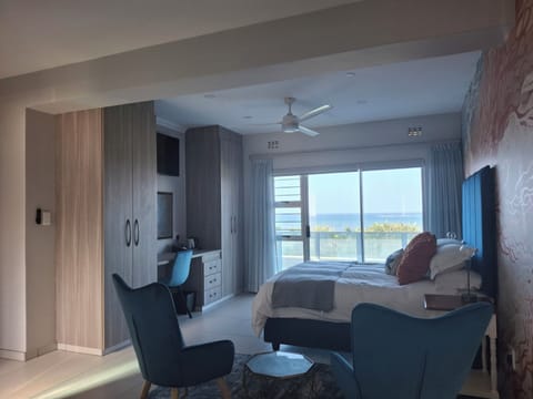 Deluxe Double Room, Patio, Sea View | In-room safe, desk, laptop workspace, blackout drapes