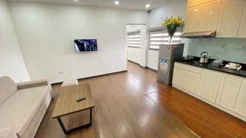 Luxury Apartment, Kitchenette, City View | Living area | 25-inch TV with cable channels