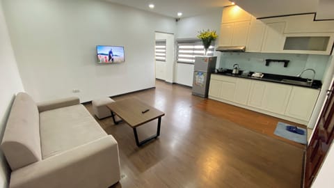 Luxury Apartment, Kitchenette, City View | Living area | 25-inch TV with cable channels