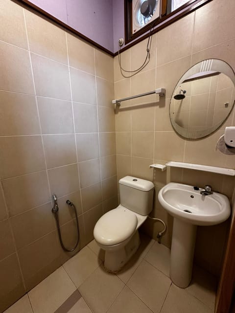 Standard Double Room, Balcony, Garden View | Raised toilet seat