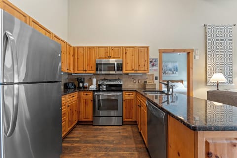 Kitchen with granite countertops and stainless steel appliances