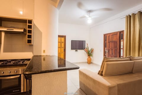 Family Apartment, 3 Bedrooms | Living area | 50-inch Smart TV with cable channels