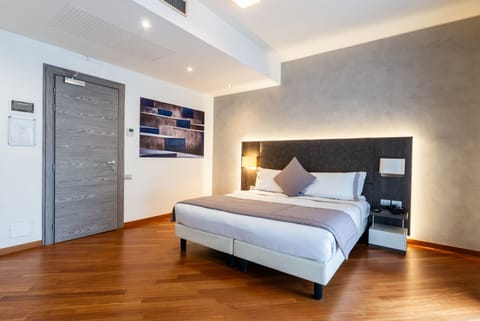 Superior Quadruple Room, 1 Bedroom | Down comforters, in-room safe, desk, laptop workspace