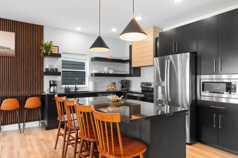 Fully equipped kitchen with service for 28, including a range of appliances and cookware.