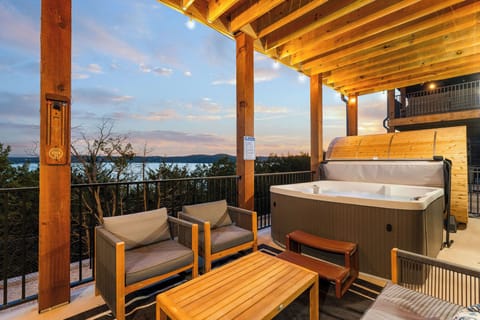 The views don't get much better! Lakefront home with Barrel Sauna, Hot Tub, incredible views, and more. You'll feel like you're sitting at the water's edge in the comfort of the home.