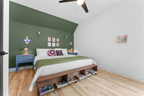 Marvel Superheroes-themed King bedroom with ensuite bathroom and comic book collection.