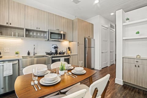 You’ll love the convenience of this fully equipped kitchen, where you can brew coffee, cook meals, or prepare snacks. The cozy layout and warm ambiance make cooking here a delightful part of your stay.