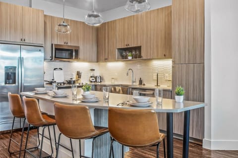 Set the table for memorable meals in this beautifully arranged dining area. With elegant place settings and a charming centerpiece, it's perfect for hosting dinner parties or enjoying family dinners in a cozy and stylish atmosphere.