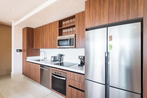 Deluxe Condo | Private kitchen | Full-size fridge, microwave, oven, stovetop