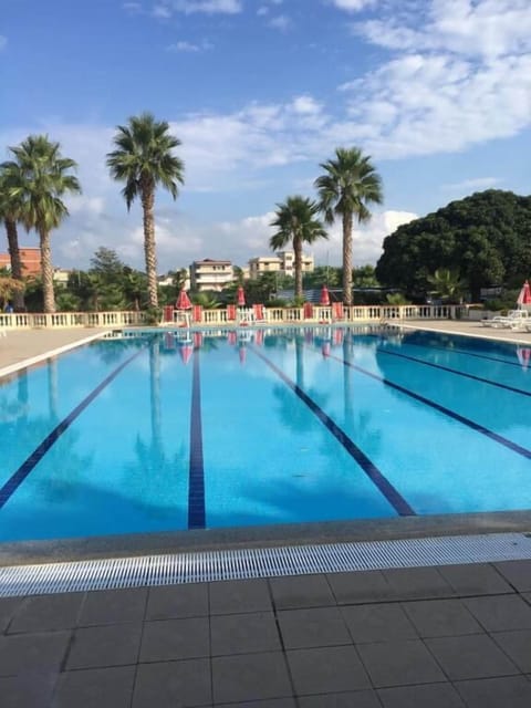 Seasonal outdoor pool, open 9:00 AM to 7:00 PM, pool umbrellas