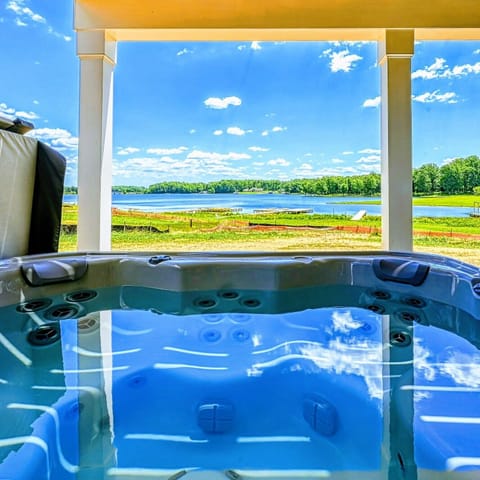 Relaxing hot tub with stunning lake views, offering a perfect spot for unwinding in nature