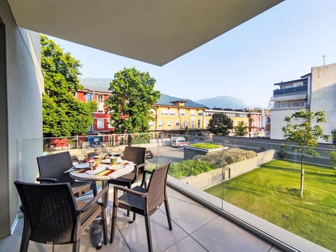 Sky, Plant, Table, Property, Furniture, Building, Chair, Flowerpot, Shade, Window