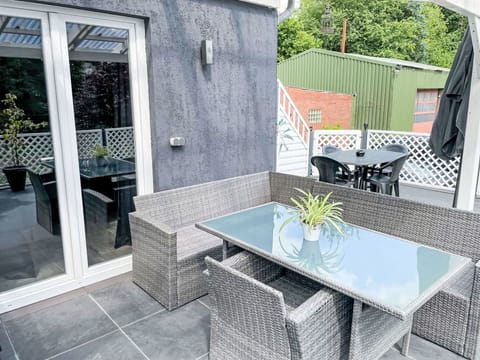 Furniture, Plant, Building, Table, Flowerpot, Chair, Outdoor Furniture, Window, House, Shade