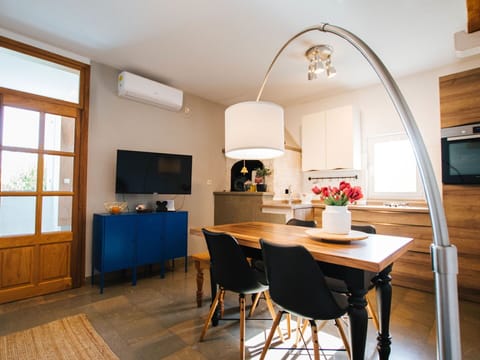 Sky, Property, Furniture, Table, Azure, Chair, Building, Window, Shade, Architecture