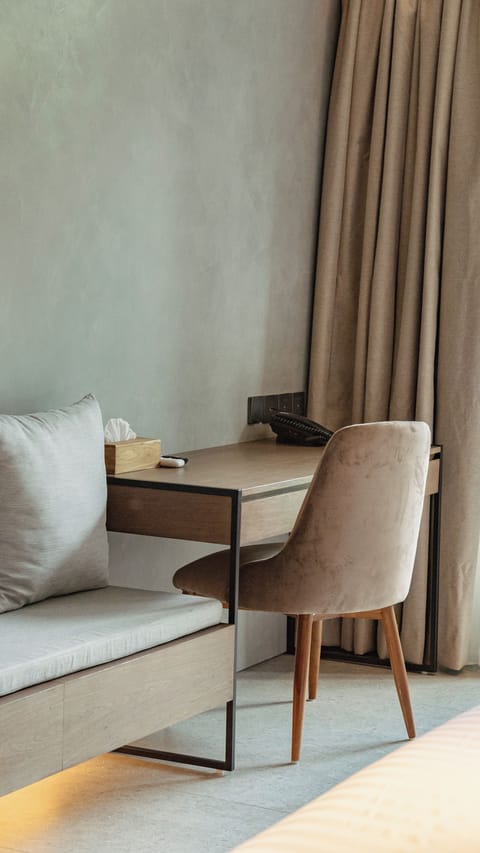 Deluxe Corner Pool Access | Minibar, in-room safe, desk, blackout drapes