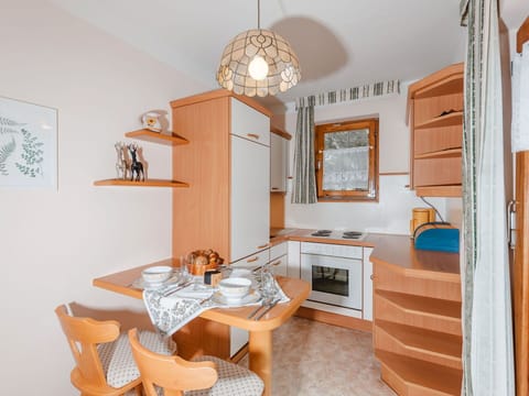 Furniture, Table, Property, Cabinetry, Chair, Wood, Orange, Lighting, Interior Design, Shelving